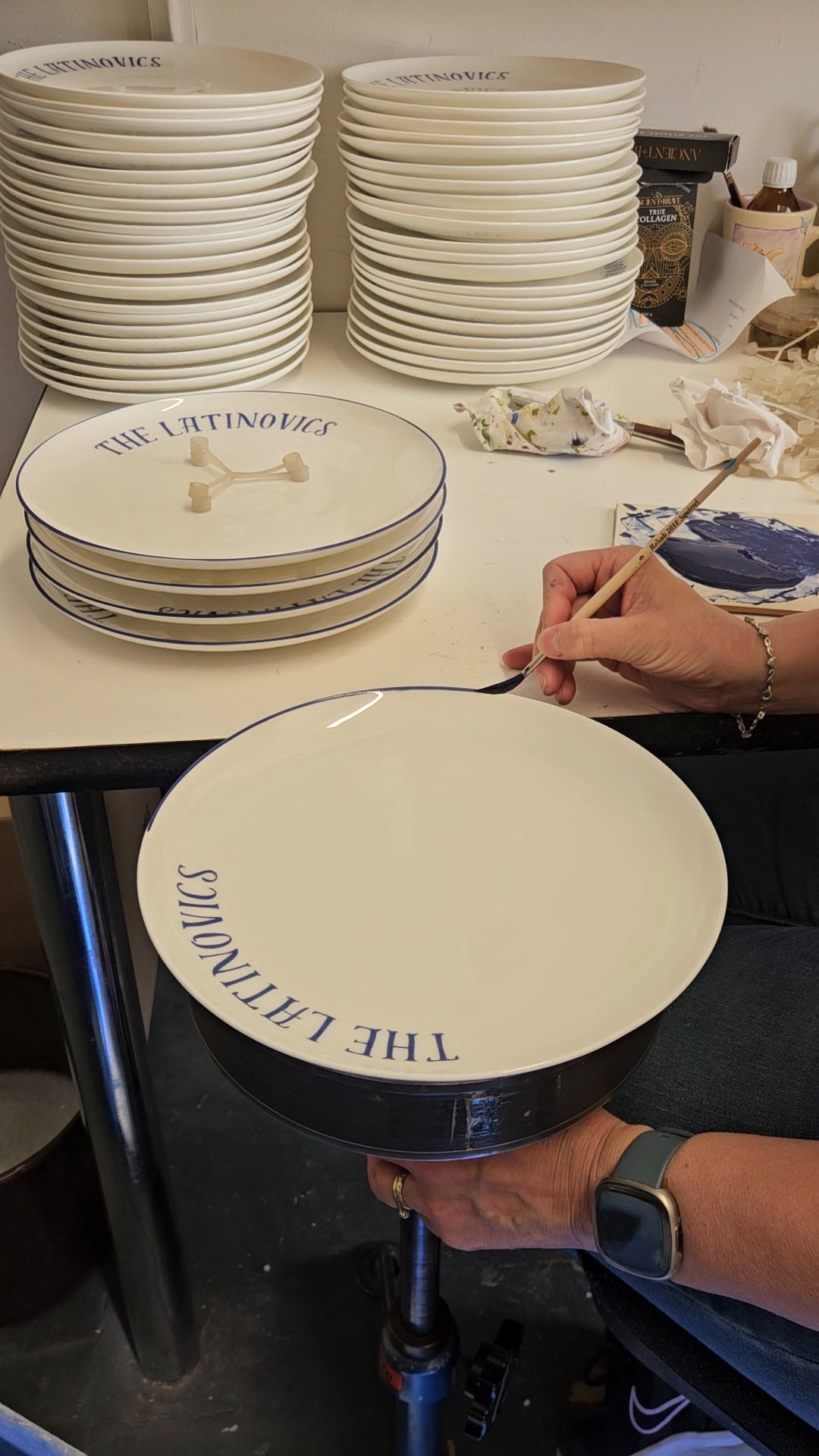 Hand banding a piece of fine bone china