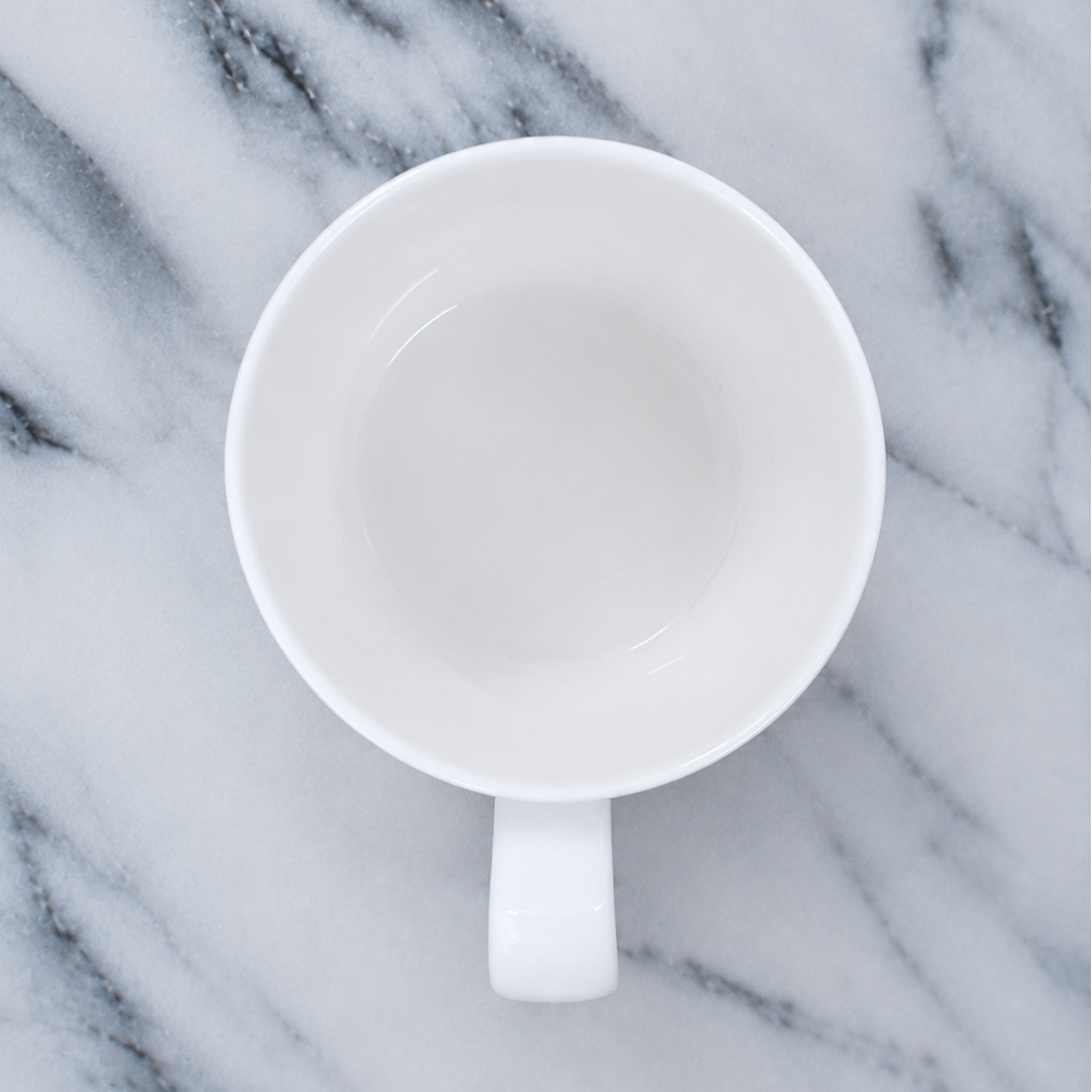 White mug on a marble surface