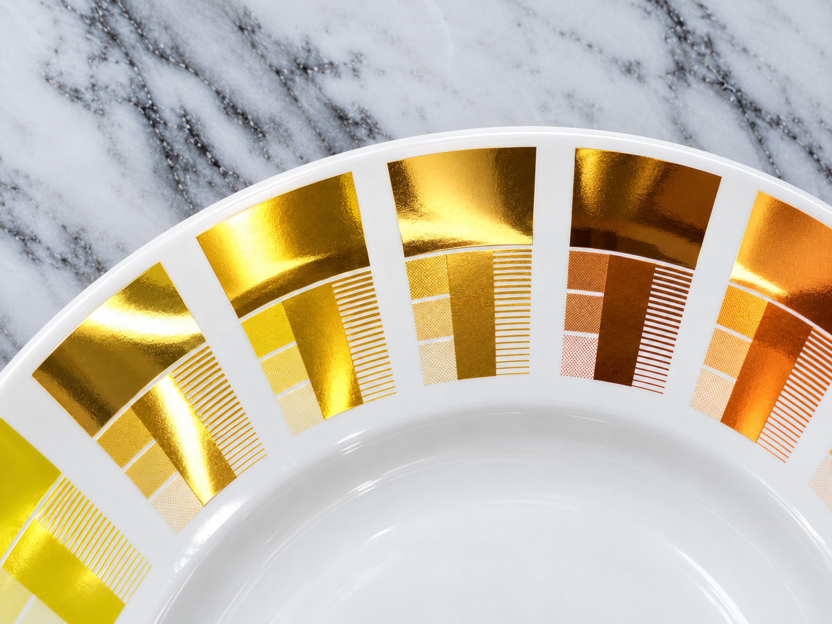 Metallic golds and copper lustres, fired on bone china.